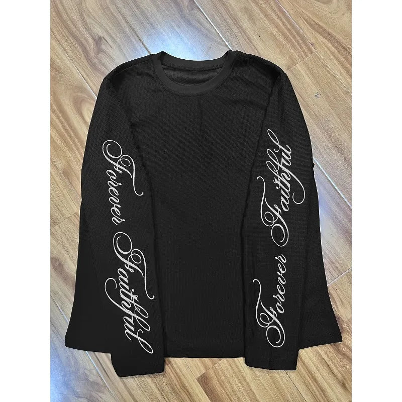 This Is A Black Waffle Patterned Long Sleeved Top with A Loose Street Style and Printed Sleeves.